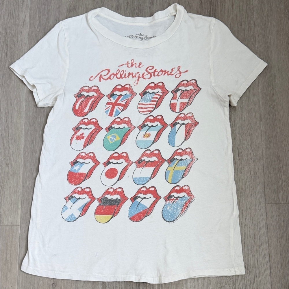 The Rolling Stones women’s light cream Tee with Rolling stone flag logo size Xs